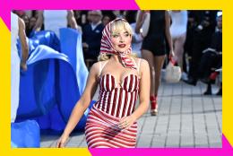 Sabrina Carpenter walks the runway in a fashion show.