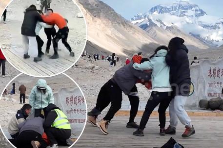 Footage captured the ludicrous moment two tourist couples brawled with each other over a viewing spot near Mount Everest.